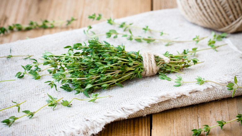 fresh thyme bundle on cloth