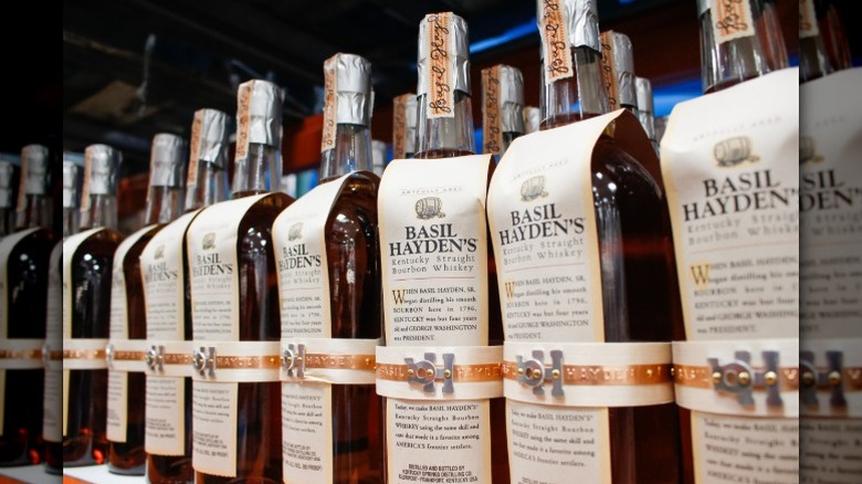 Bottles of Basil Hayden's Small Batch Kentucky Bourbon on a shelf in a store