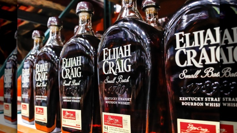 Bottles of Elijah Craig Small Batch bourbon on a shelf in a store