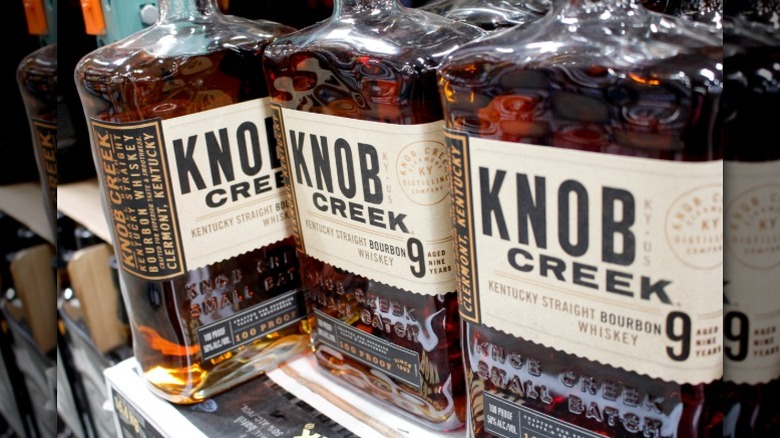 Three bottles of Knob Creek 9 Year bourbon on a shelf