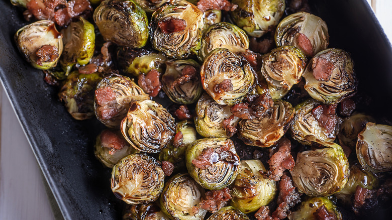 cooked Brussels sprouts in pan with bacon