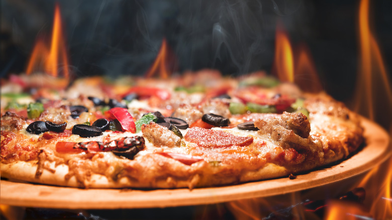 Close up of supreme pizza with thin crust