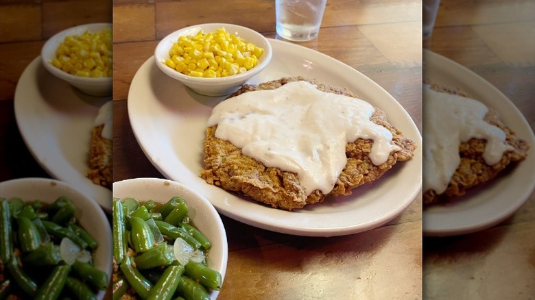 Texas Roadhouse's country fried steak on plate with sides