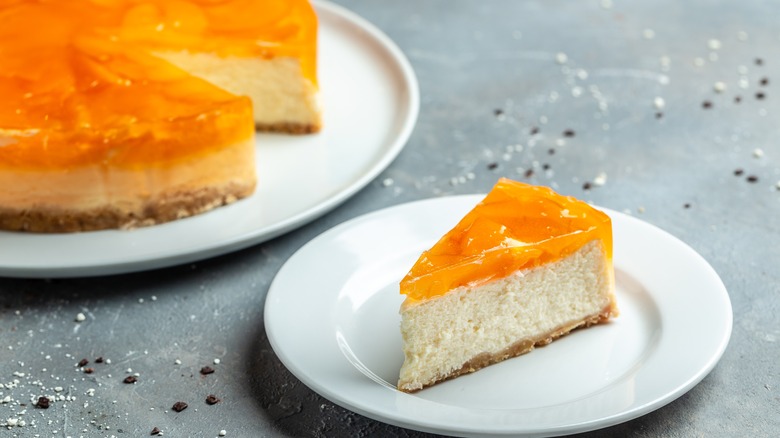 A slice of cheesecake with fruit on top