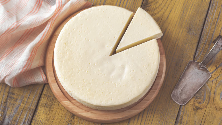 Cheesecake being cut 