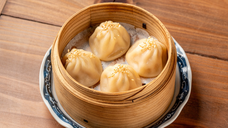 Soup dumplings in bamboo steamer