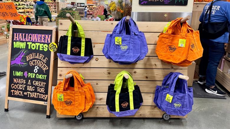 A display showing tote bags from Trader Joe's for Halloween