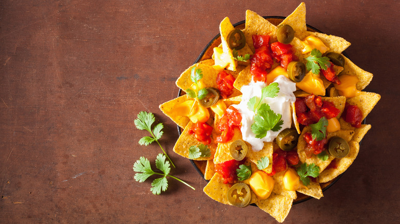 bowl of nachos with toppings