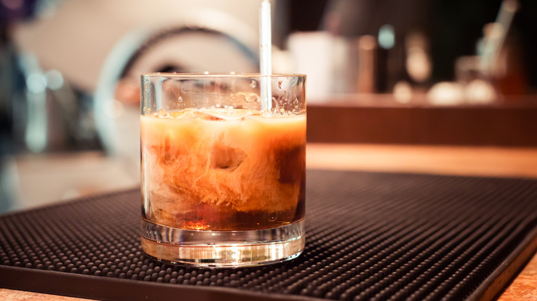 White Russian cocktail sitting on a bar