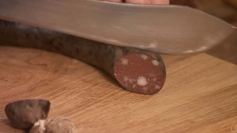 Black pudding being sliced