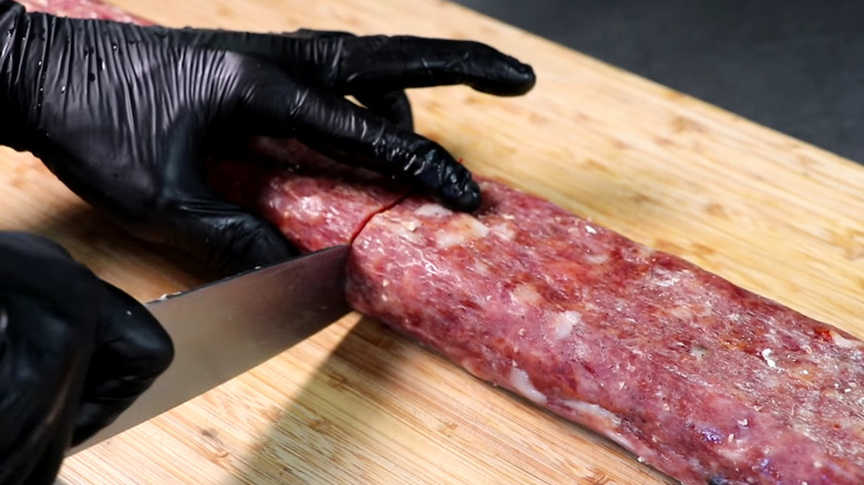 Soppressata being cut