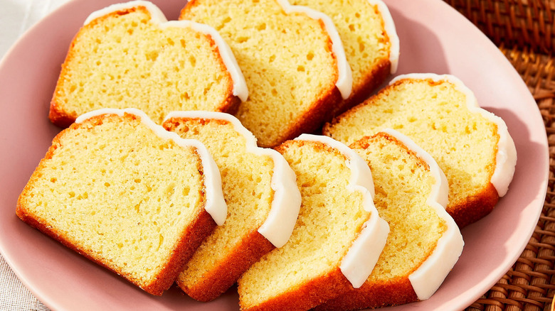 Lemon iced cake slices on a pink plate