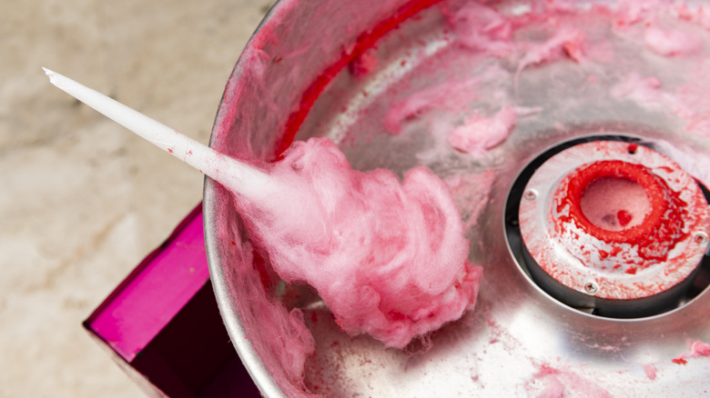 https://www.thedailymeal.com/img/gallery/the-best-way-to-clean-a-stubbornly-sticky-cotton-candy-machine/start-off-with-a-simple-rinse-and-wipe-down-1693924233.jpg