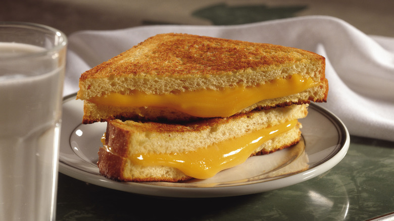 grilled cheese sandwich with cheese oozing out
