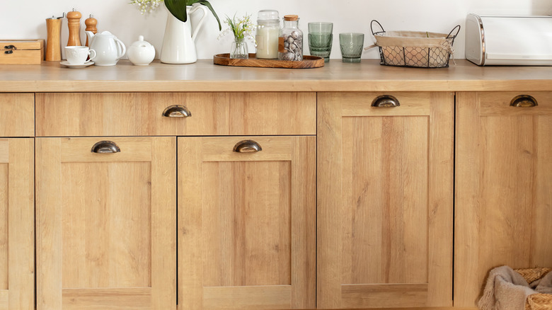 Wooden kitchen cabinets stack with decorative items