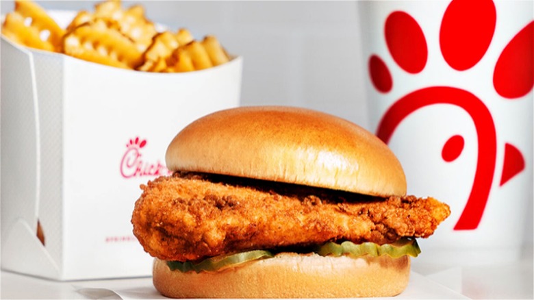 Chick-fil-A sandwich with wedges and drink