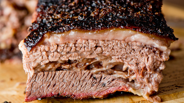 Barbecued brisket on wooden cutting board