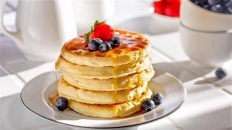 Stack of freezer waffles with berries 