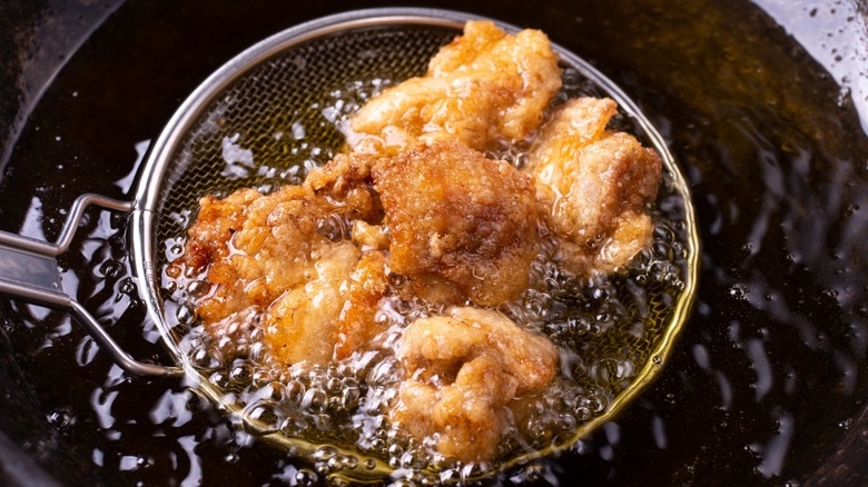 chicken frying in oil