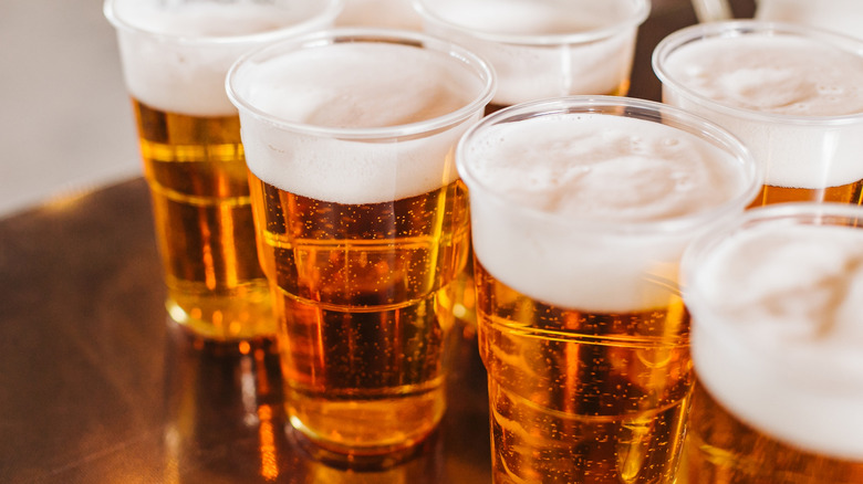 Cups of beer with foam