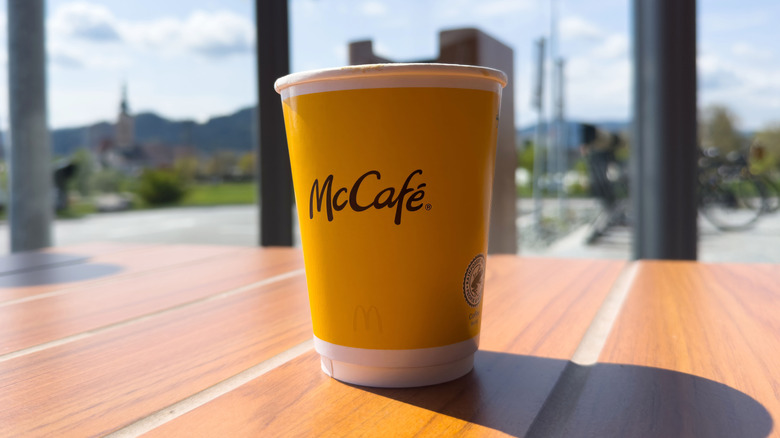 A McCafé cup is seen in the sunlight in a McDonald's restaurant