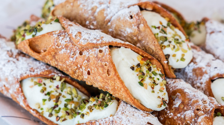 Several cannoli in a pile