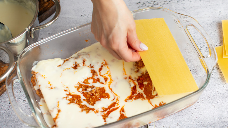 Step-by-step preparation of lasagna.
