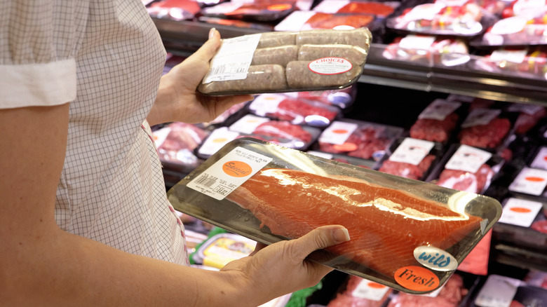 Person holding store fish packet