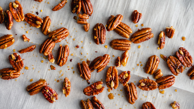 roasted pecans on parchment paper