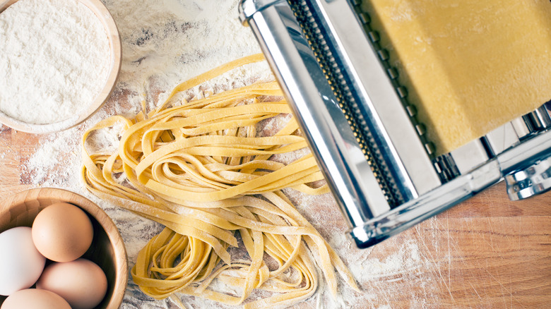 pasta maker, eggs, flour and fresh pasta