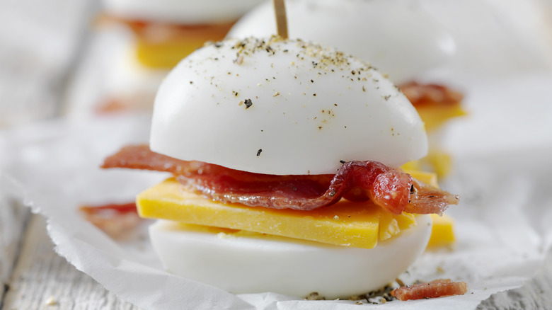 Hard boiled egg sandwiches with bacon and cheese