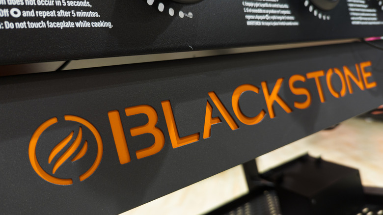 A close up of a griddle with the Blackstone logo