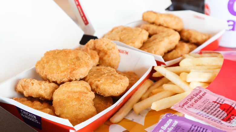 a tray of chicken mcnuggets and fries