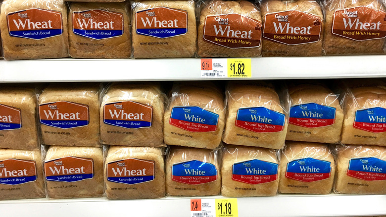 Rows of loaves of sandwich bread on a Walmart grocery shelf