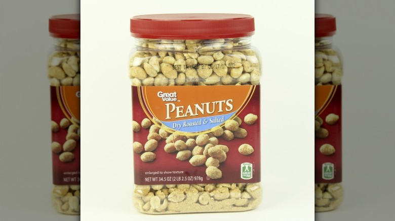 A jar of Great Value peanuts against a white background