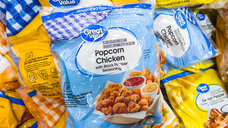 A pile of Great Value frozen chicken bags, including popcorn chicken and lemon pepper chicken