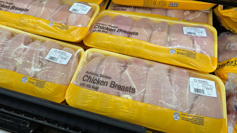 Packages of boneless, skinless chicken breast on display at Walmart