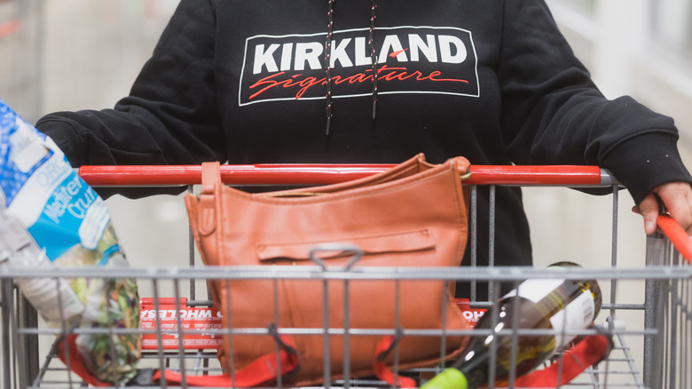 wearing kirkland sweatshirt shopping