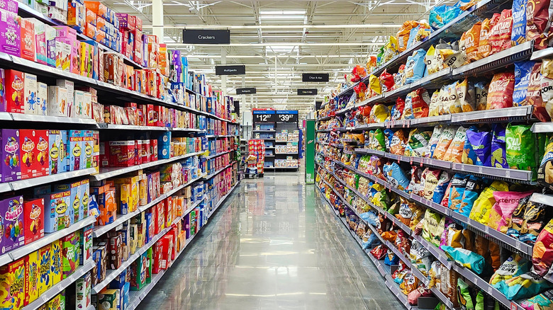 Walmart snack aisle filled with chips, fruit snacks, and others