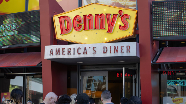 Customers gathered outside a Denny's