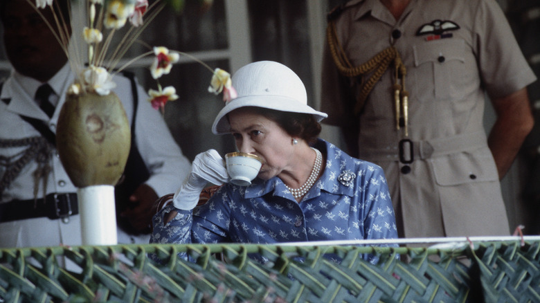 Queen Elizabeth II sipping a cup of tea