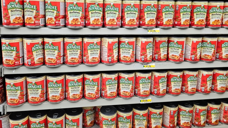 shelf at grocery store stocked with chef boyardee cans