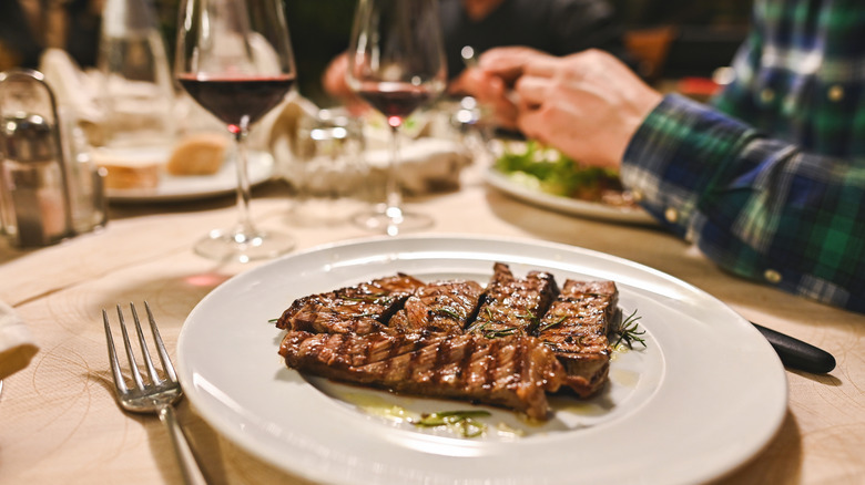 Exterior signage and outdoor patio at The Capital Grille in New York City