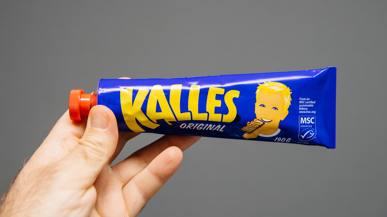 Hand holding Kalles Kaviar