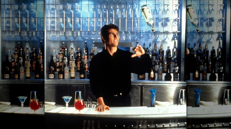 Tom Cruise showing his tricks as a bartender in a scene from the film 'Cocktail', 1988.