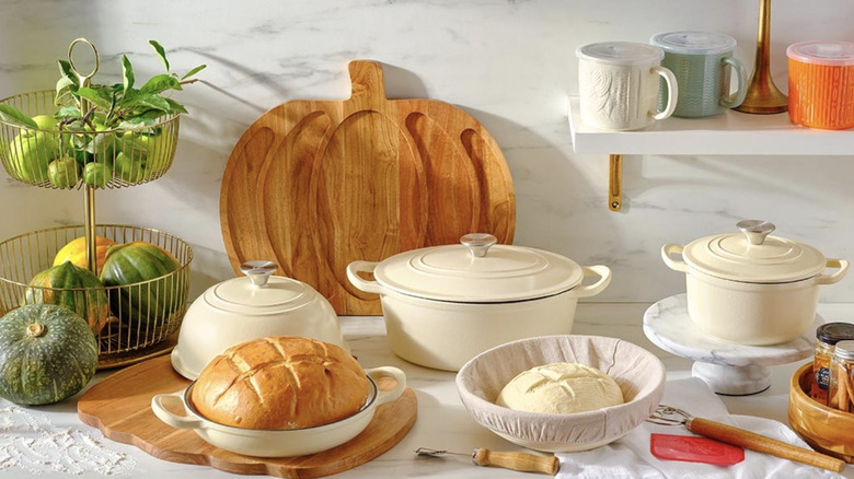 Aldi's French and Dutch ovens along with related products, displayed on a kitchen counter