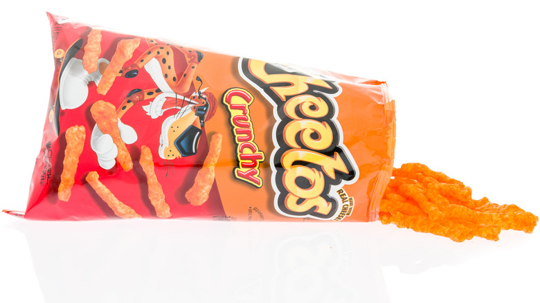 Plastic bag spilling out Cheetos