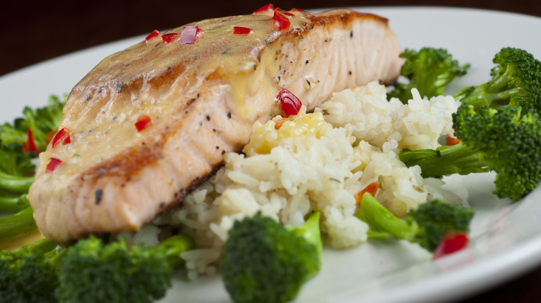 steamed salmon over rice and vegetables