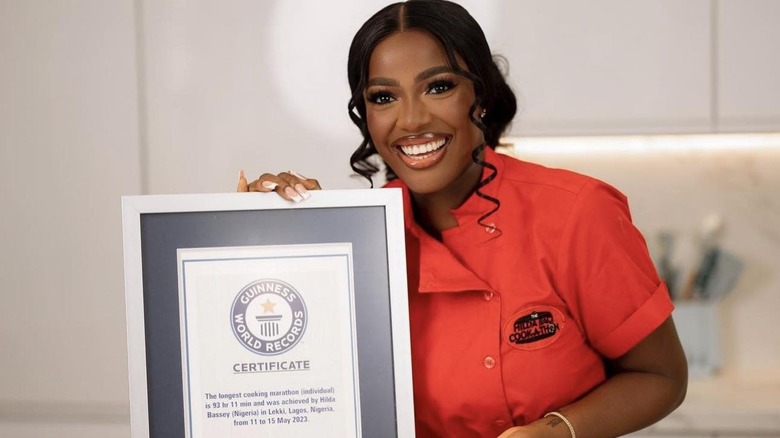 Hilda Baci holds her Guinness World Records certificate for longest cooking marathon