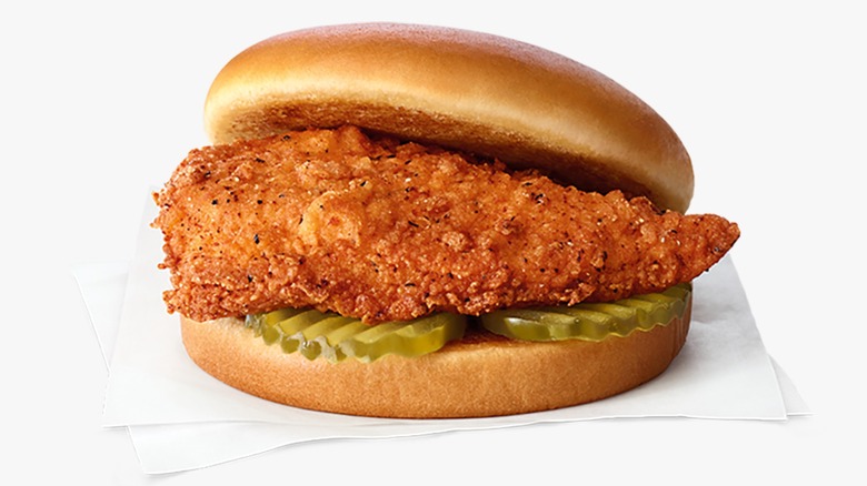 A Chick-fil-A Spicy Chicken Sandwich on a napkin on a white background